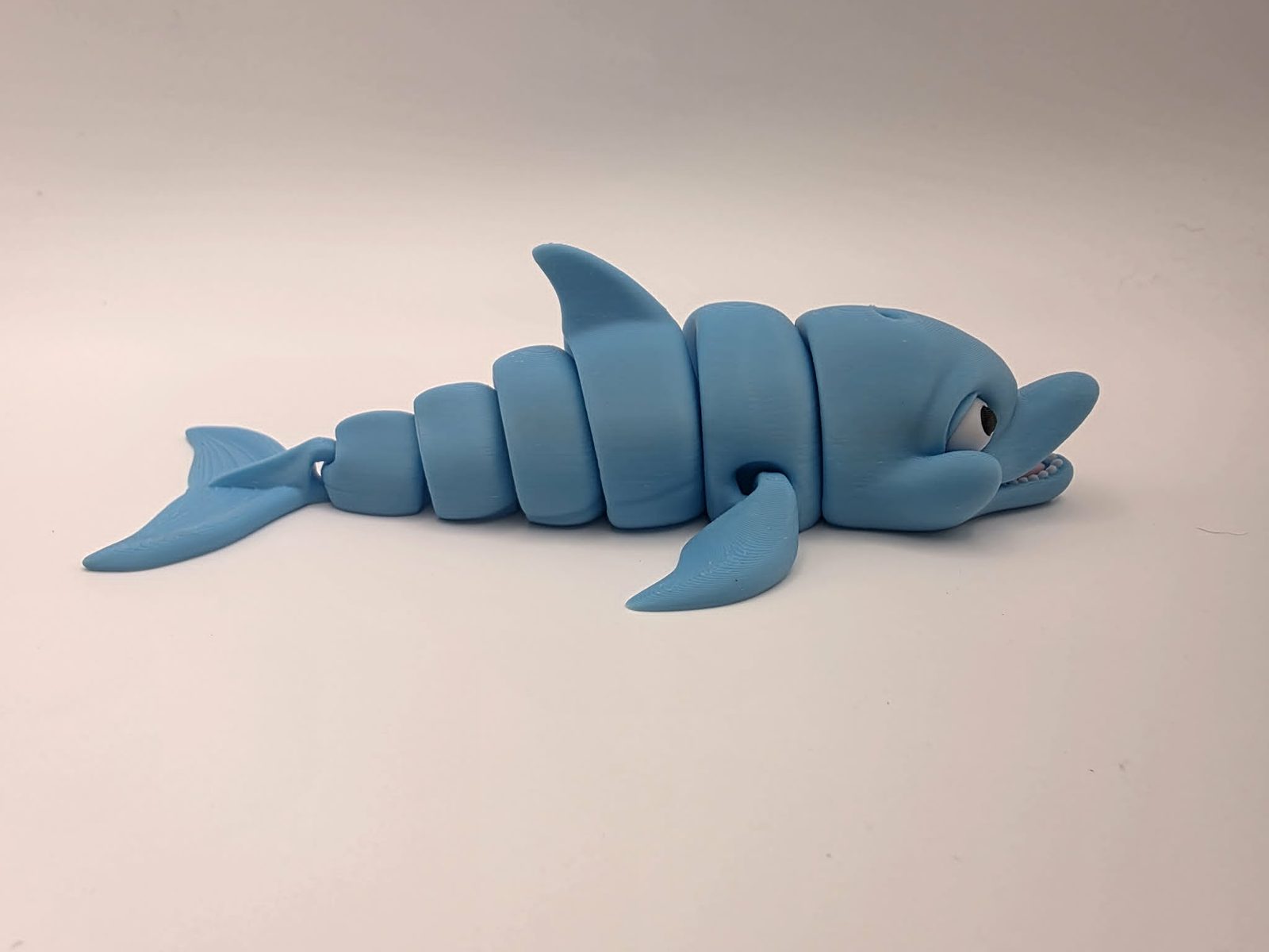 Dolphins - Ocean Giggles - 6" Long x 3.5" Wide Tip of Fin to Tip of Fin x 1.5" Tall - Sky Blue, White, Black, Sakura Pink 3D printed item image