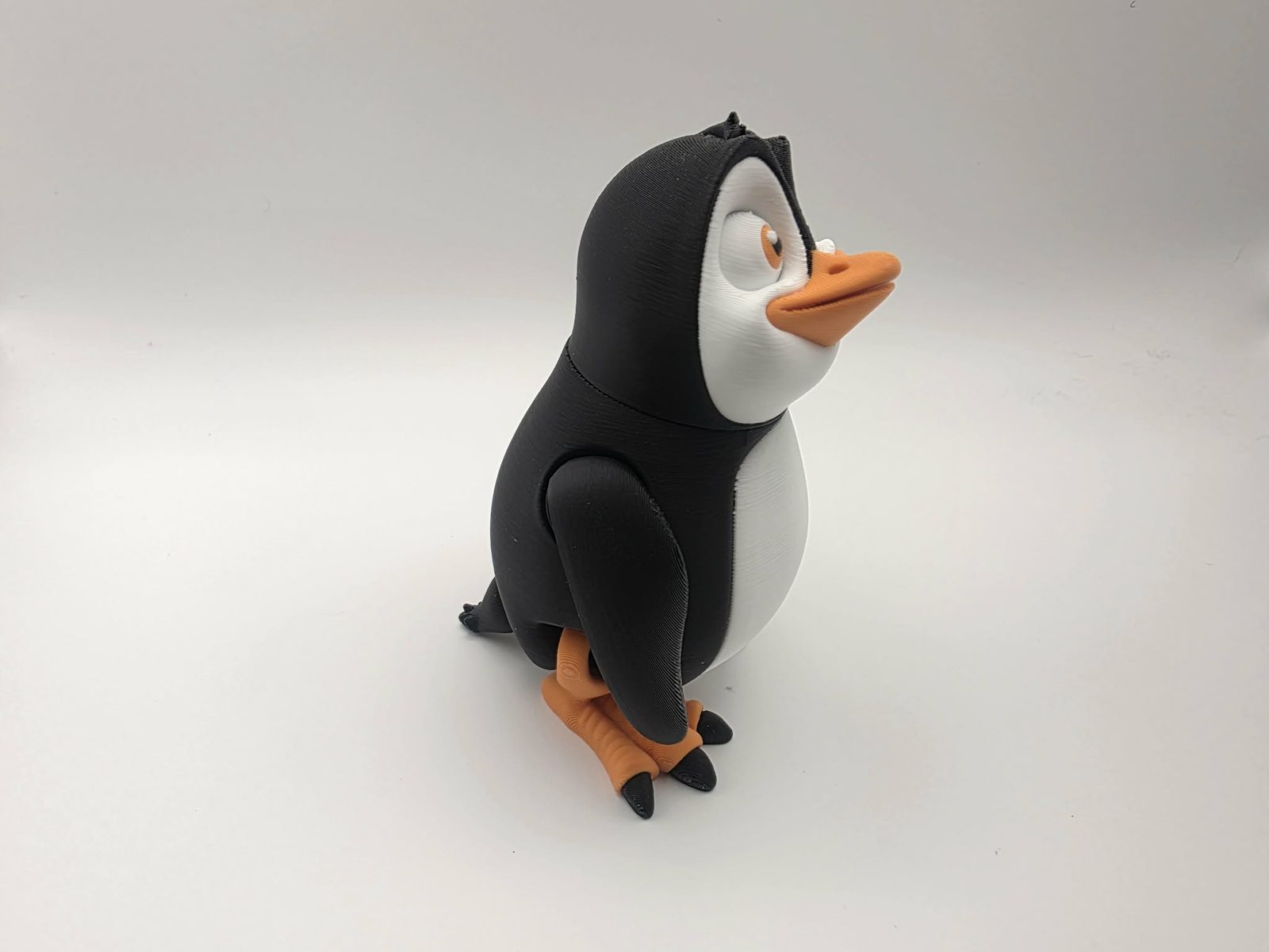 Penguin - Wally Waddles - 3" Wide x 2.5" Chest to Tail x 4.25" - 5" Tall - Black, White, Sunny Orange 3D printed item image