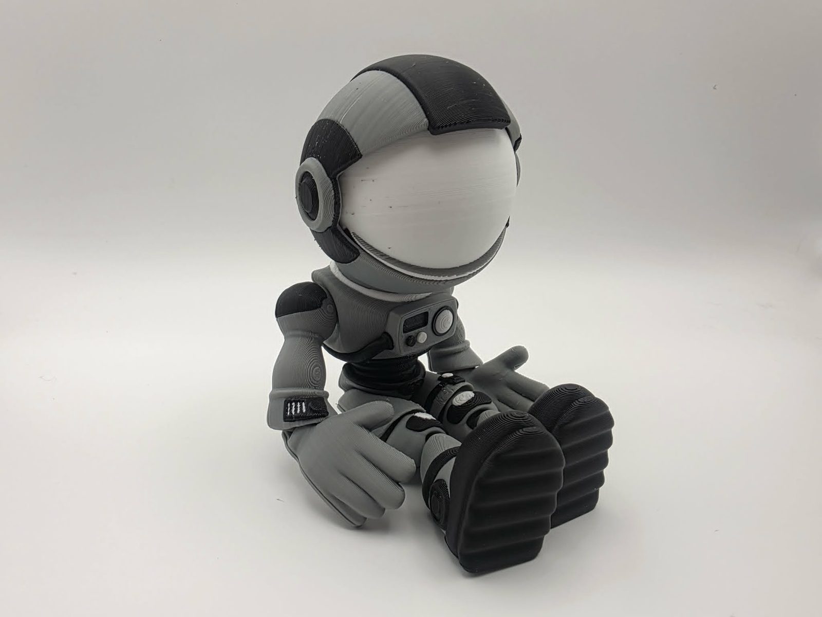 Astronaut - Orbit Oliver - 3" Wide Outer Arm to Outer Arm x 1.5" Chest to Back x 6.25" Tall - Gray, Black, White, Beige 3D printed item image