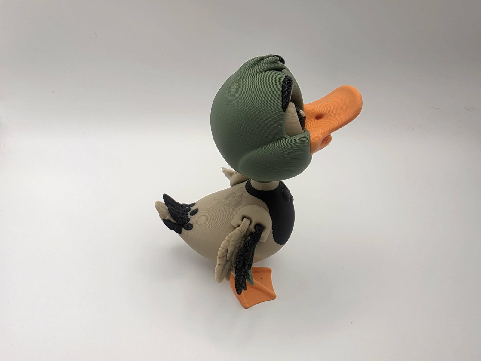 Mallard Duck - Pond Pal Mallard - 3.25" Outer Wing to Outer Wing x 3" Chest to Tail x 4.5" Tall - Matte Light Brown, Black, Olive Green, Sunny Orange 3D printed item image
