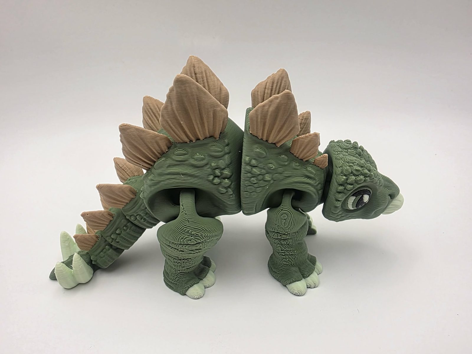 Stegosaurus - Stego Sprout - 5.5" Long x 2" Wide x 2.75" Tall - Matte Olive Green, Matte Light Brown, Matte Mint Green, Black 3D printed item image